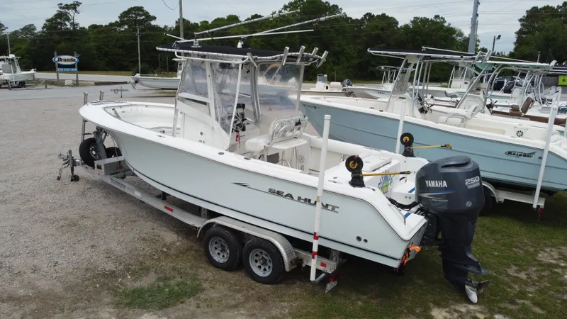 Slide: The Image of 2010 Sea Hunt 24 Gamefish boat on trailer with Yamaha engine. - 4