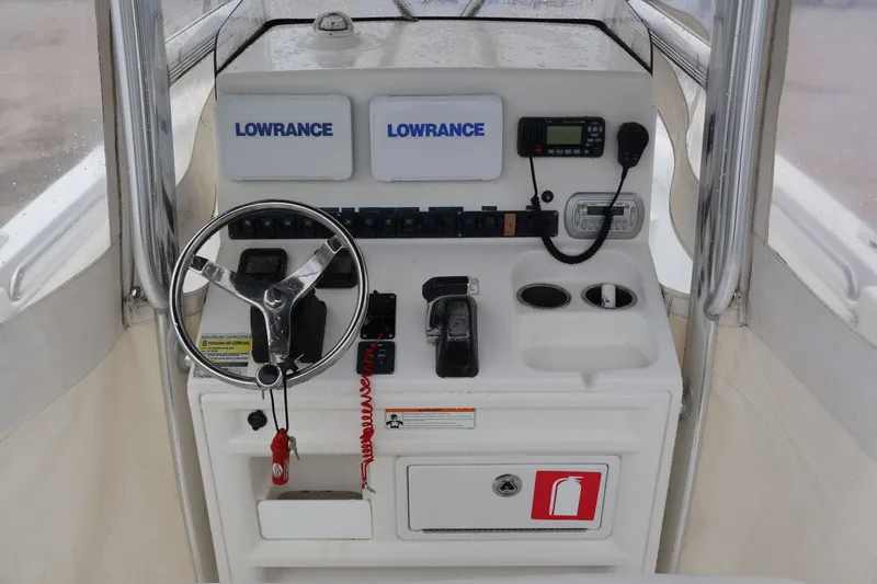 Slide: The Image of Helm console of a 2010 Sea Hunt 24 Gamefish boat. - 7