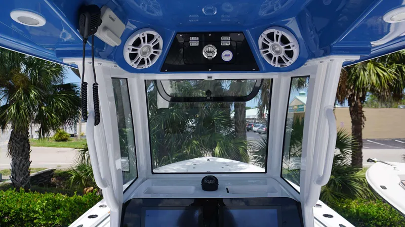 Slide: The Image of Interior view of 2024 Sportsman 267 Masters OE boat console with speakers and navigation equipment. - 8