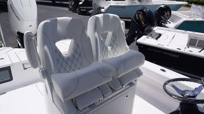 Slide: The Image of 2024 Sportsman 267 Masters OE boat seats and steering wheel. - 9