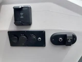 Slide: The Image of 2024 Sweetwater 2286SFL control panel with power outlets and switches. - 13