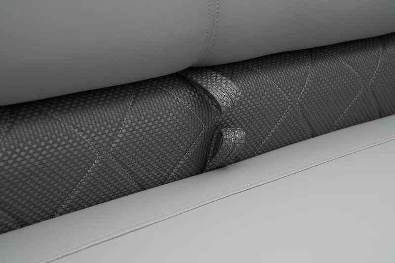 Slide: The Image of 2024 Regency 230 LE3 Sport boat seat close-up, grey upholstery with textured pattern. - 25