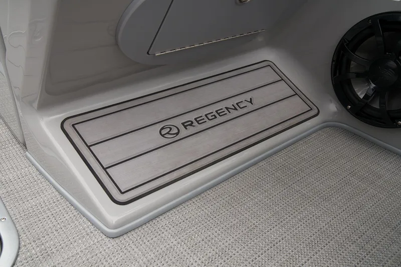 Slide: The Image of 2024 Regency 230 LE3 Sport boat interior with branded floor mat. - 35