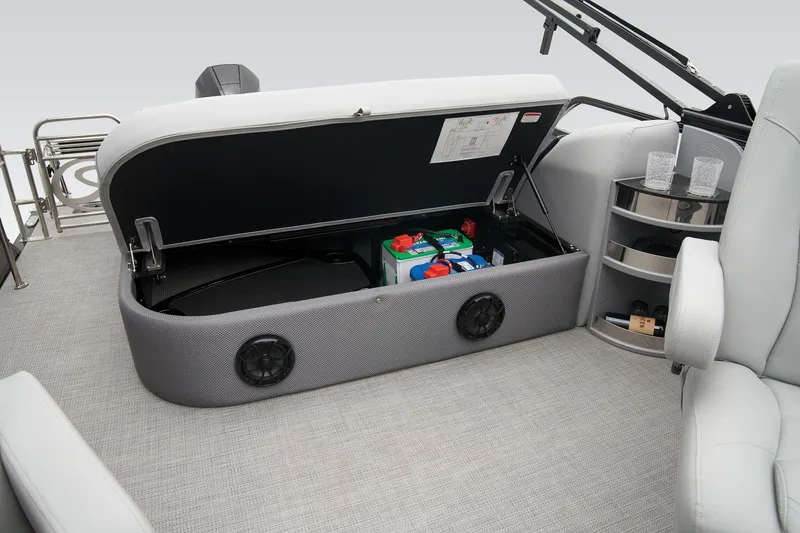 Slide: The Image of 2024 Regency 230 LE3 Sport boat interior storage compartment with batteries. - 40