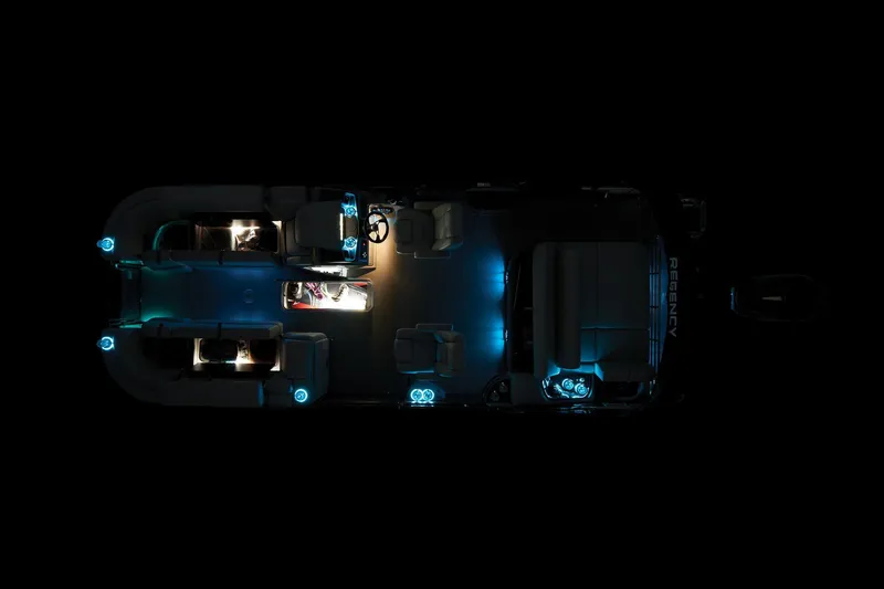 Slide: The Image of 2024 Regency 230 LE3 Sport pontoon boat interior with ambient lighting. - 51