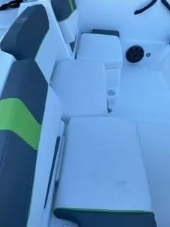 Slide: The Image of 2024 Tahoe T18 boat interior with green and gray seating. - 5