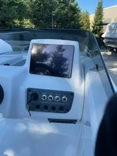 Slide: The Image of 2024 Tahoe T18 boat dashboard with control panel and display screen. - 6