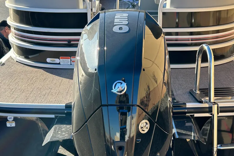 Slide: The Image of 2023 Ranger Reata 243C pontoon boat with a powerful 250 HP Mercury outboard motor. - 2