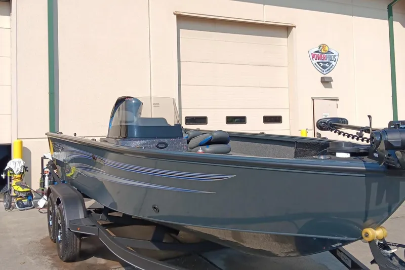 Slide: The Image of 2024 Ranger VS1882SC Angler boat on trailer outside a building. - 3