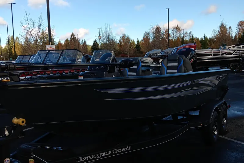 Slide: The Image of 2024 Ranger VS1882SC Angler boat on display in a parking lot. - 9
