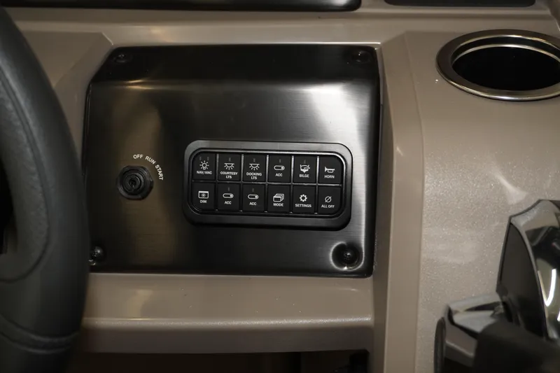 Slide: The Image of 2024 Sun Tracker Party Barge 22 XP3 dashboard with control panel and cup holder. - 11