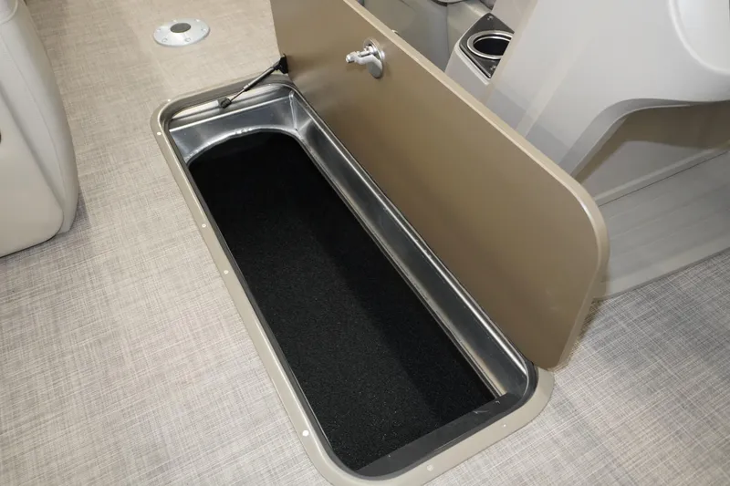 Slide: The Image of 2024 Sun Tracker Party Barge 22 XP3 storage compartment with open hatch on deck. - 5