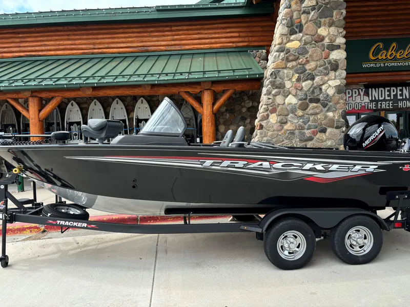 The Image of 2024 Tracker Targa V-19 Combo boat on trailer outside Cabela's store. - 0