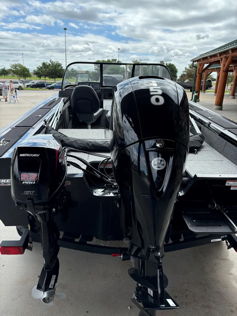 Slide: The Image of 2024 Tracker Targa V-19 Combo boat with Mercury outboard motors. - 2