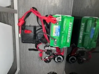 Slide: The Image of 2024 Sweetwater 2286C boat battery setup with Interstate batteries and wiring. - 13