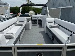 Slide: The Image of 2024 Sweetwater 2286C pontoon boat with spacious seating and modern design. - 6