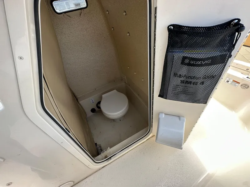 Slide: The Image of 2023 Sea Chaser 24 HFC boat interior with compact marine toilet. - 12