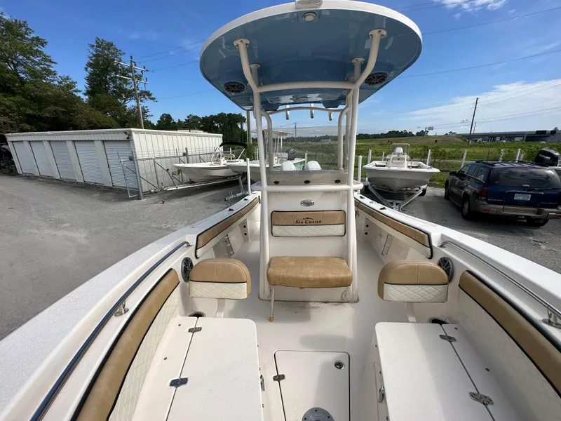 Slide: The Image of 2023 Sea Chaser 24 HFC boat with center console and cushioned seating. - 15