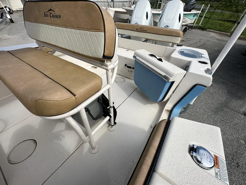 Slide: The Image of 2023 Sea Chaser 24 HFC boat interior with seating and storage compartments. - 8