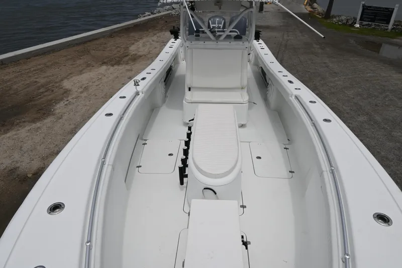 Slide: The Image of 2004 Yellowfin 36 boat interior with white seating and console. - 10
