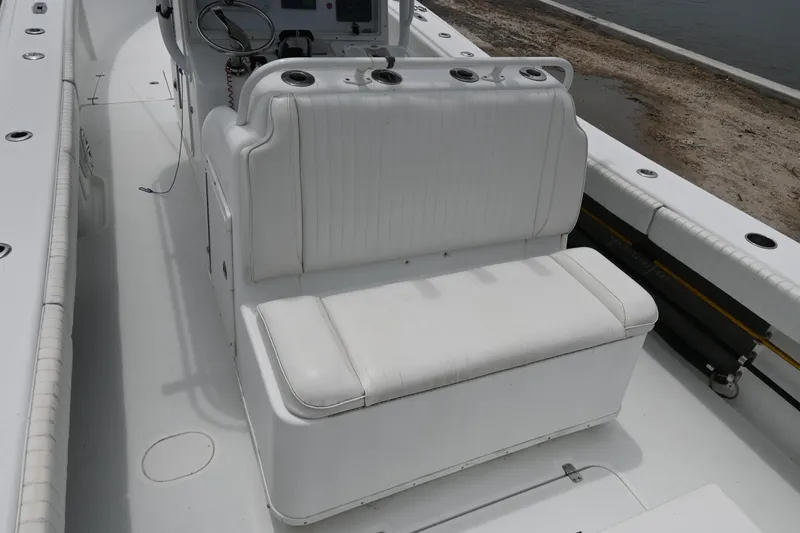 Slide: The Image of 2004 Yellowfin 36 boat with white cushioned seating and console. - 12