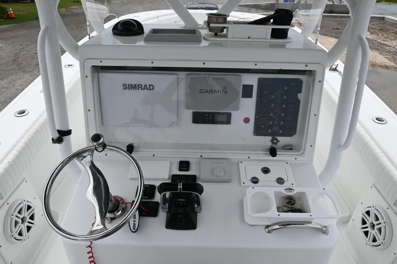 Slide: The Image of 2004 Yellowfin 36 boat console with Simrad and Garmin navigation systems. - 14