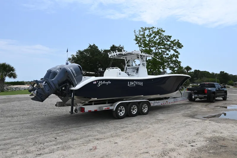 Slide: The Image of 2004 Yellowfin 36 boat on a trailer, ready for transport. - 2