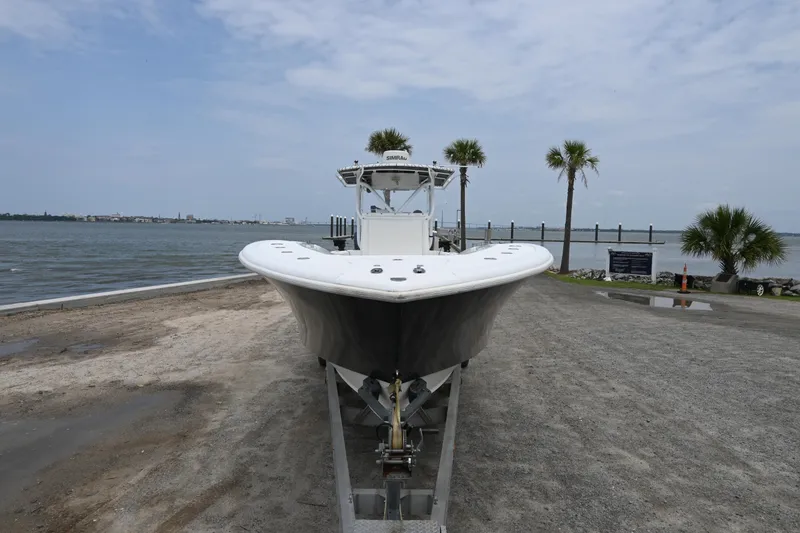 Slide: The Image of 2004 Yellowfin 36 boat on trailer by the waterfront. - 3
