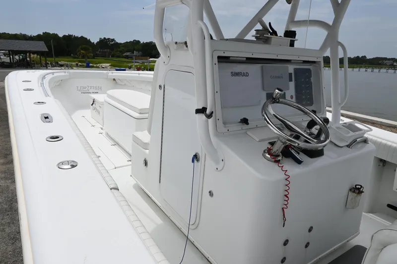 Slide: The Image of 2004 Yellowfin 36 boat with Simrad navigation system and spacious deck. - 7