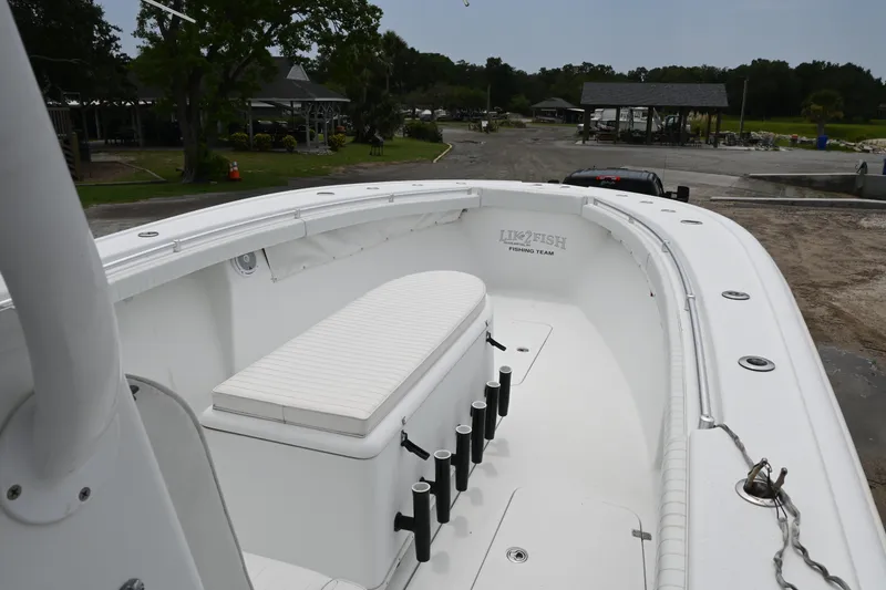 Slide: The Image of 2004 Yellowfin 36 boat with white seating and rod holders. - 9