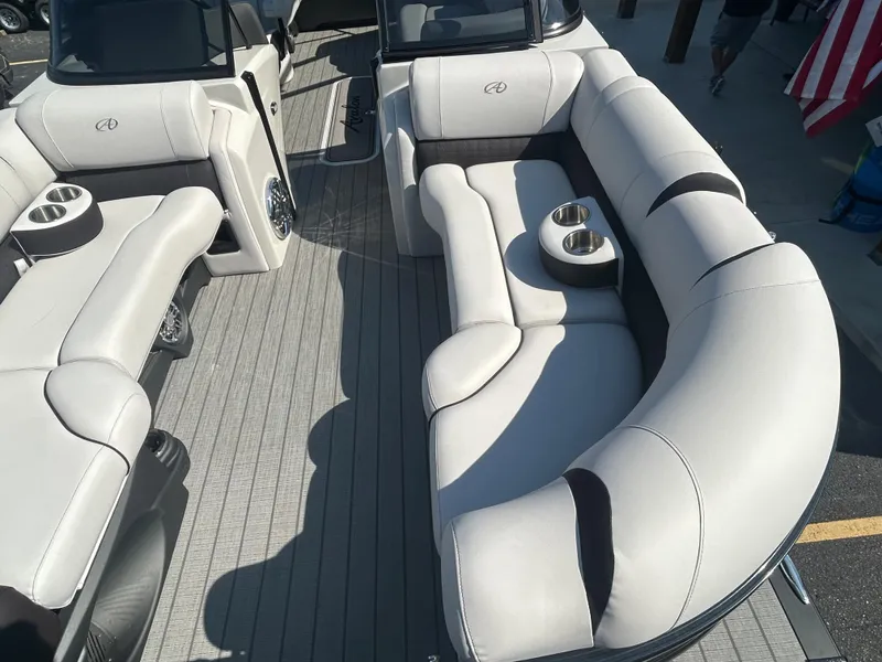 Slide: The Image of 2023 Avalon 2585 EL boat interior with luxurious seating and cup holders. - 10