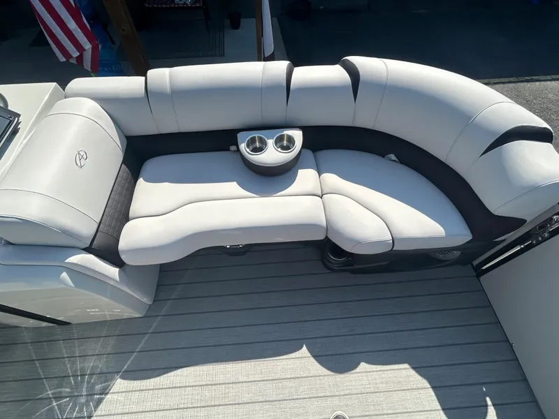 Slide: The Image of 2023 Avalon 2585 EL boat with luxurious white and gray seating and cup holders. - 12