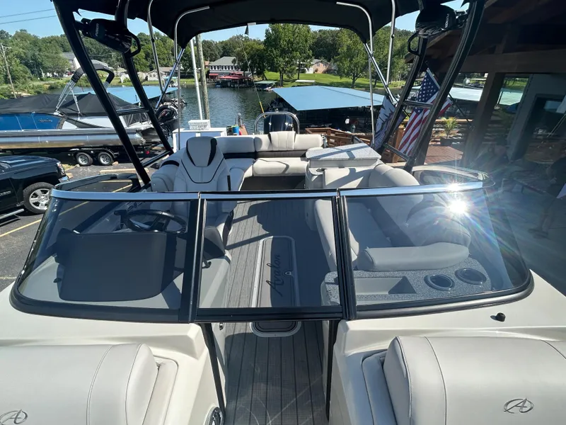 Slide: The Image of 2023 Avalon 2585 EL pontoon boat with luxurious seating and sleek design. - 14