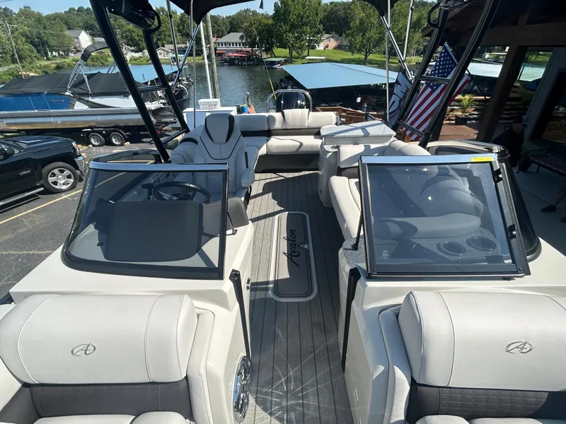 Slide: The Image of 2023 Avalon 2585 EL pontoon boat interior with seating and helm station. - 15