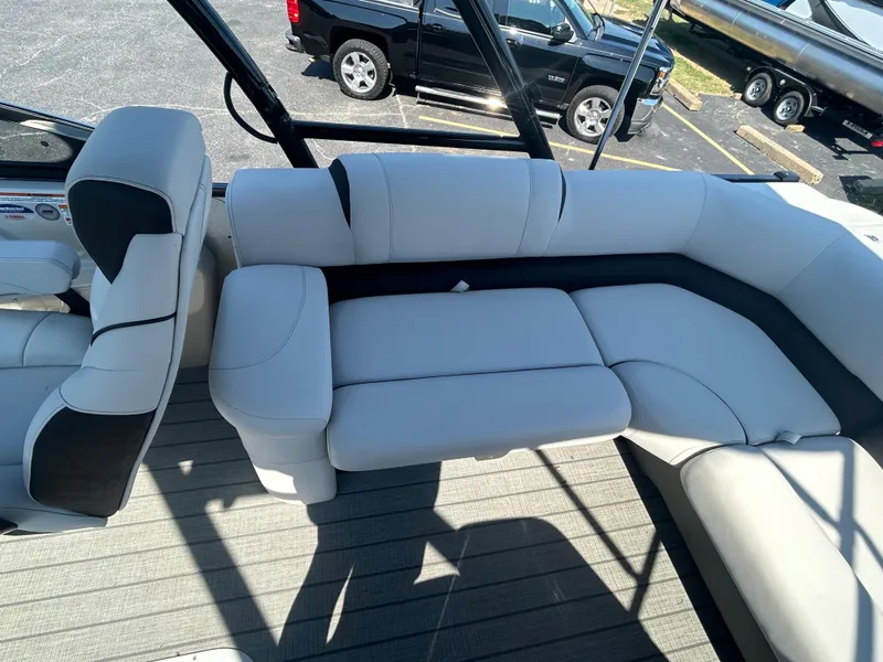 Slide: The Image of 2023 Avalon 2585 EL boat interior with white and black seating. - 22