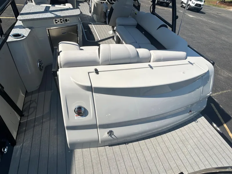 Slide: The Image of 2023 Avalon 2585 EL boat interior with white seating and deck. - 28