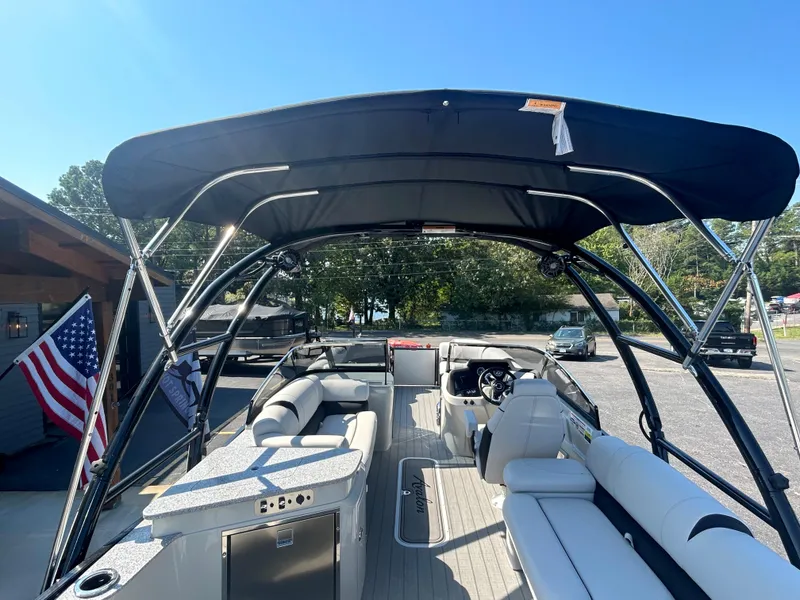Slide: The Image of 2023 Avalon 2585 EL pontoon boat interior with canopy and seating. - 31