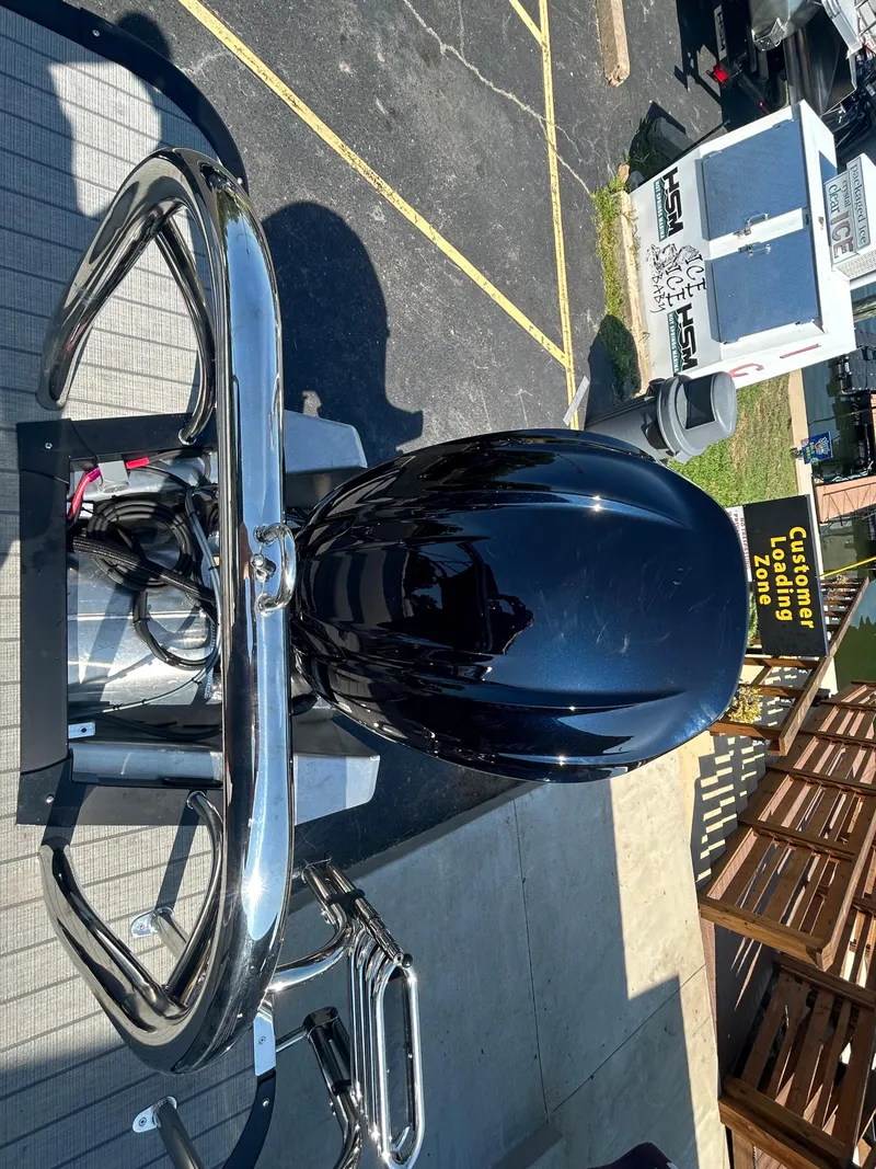 Slide: The Image of 2023 Avalon 2585 EL boat engine and rear view in a parking lot. - 32