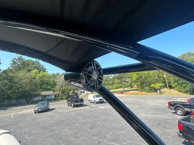 Slide: The Image of 2023 Avalon 2585 EL boat with black canopy and speaker system. - 33