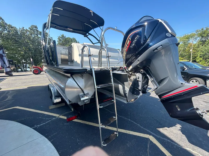 Slide: The Image of 2023 Avalon 2585 EL pontoon boat with outboard motor and ladder. - 6