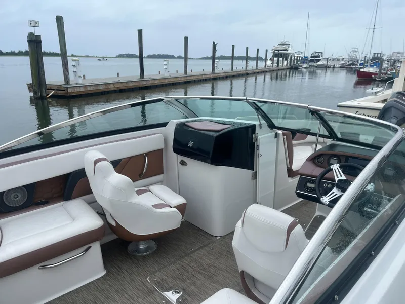 Slide: The Image of 2017 Four Winns 24 Bow Rider boat interior at marina. - 3