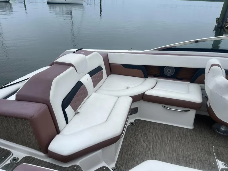Slide: The Image of 2017 Four Winns 24 Bow Rider boat with white and brown seating. - 6