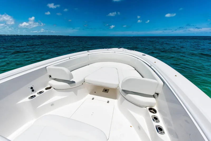 Slide: The Image of 2024 Edgewater 325CC boat with spacious seating on open water. - 3