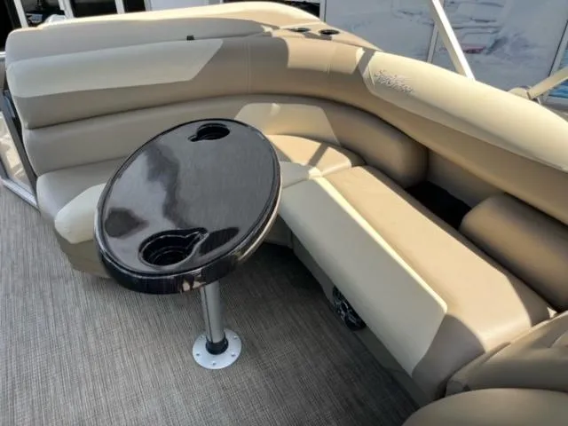 Slide: The Image of 2024 SunChaser Geneva Cruise 20 boat interior with beige seating and black table. - 20