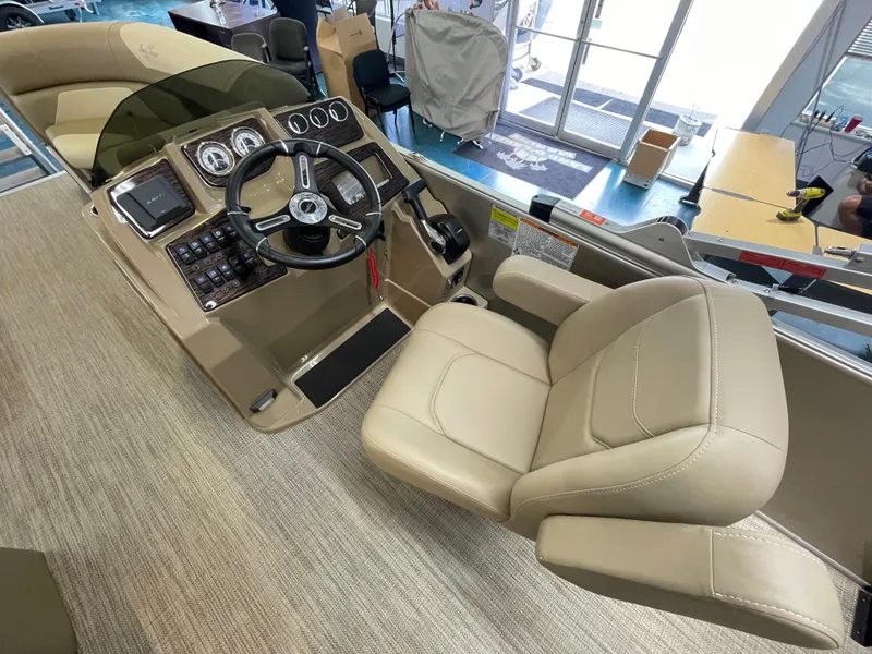 Slide: The Image of 2024 SunChaser Geneva Cruise 20 boat cockpit with steering wheel and captain's chair. - 5