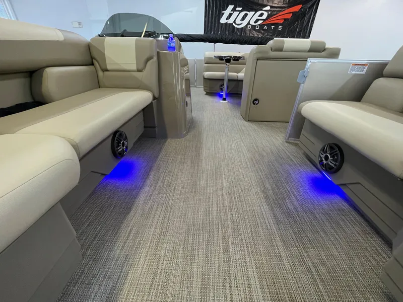 Slide: The Image of Interior of 2024 SunChaser Geneva Cruise 20 pontoon boat with blue LED lighting. - 7