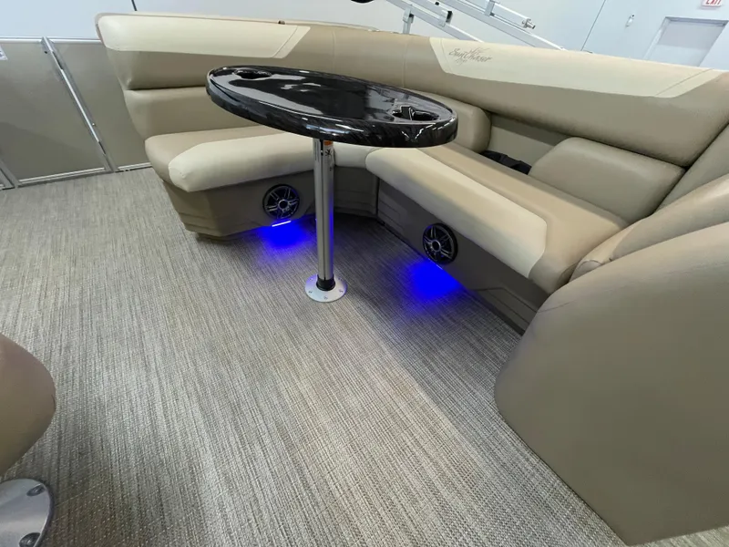 Slide: The Image of 2024 SunChaser Geneva Cruise 20 interior with beige seating, black table, and blue LED lighting. - 8