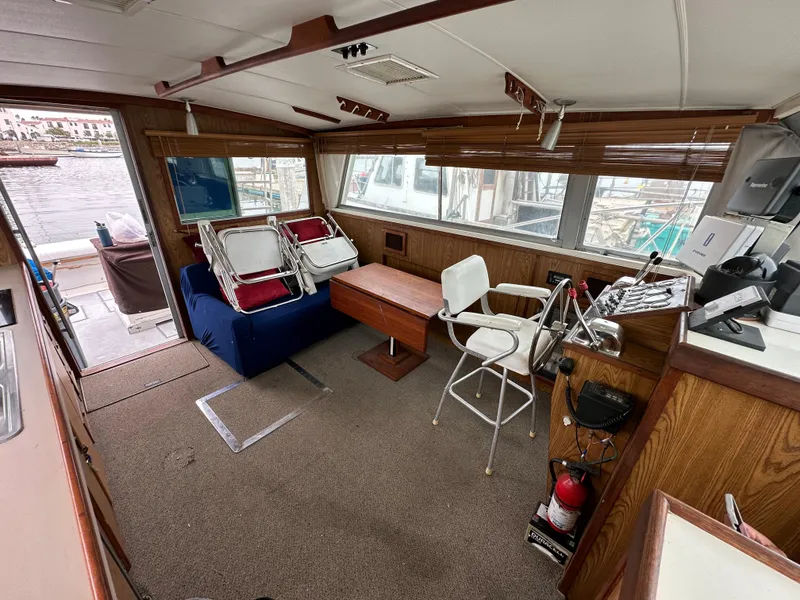 Slide: The Image of Interior of a 1981 Bertram 38III Convertible yacht with seating and helm station. - 15