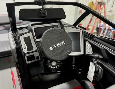 Slide: The Image of 2023 Supra SA boat dashboard with Gussi Italia steering wheel cover and advanced control panels. - 13