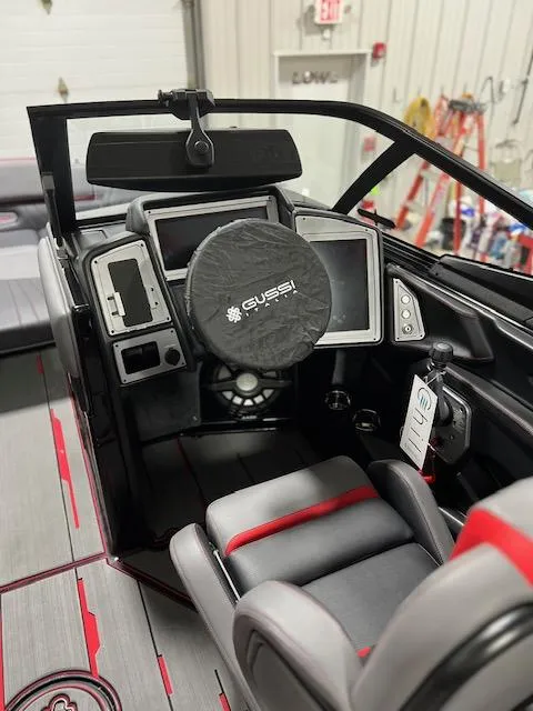 Slide: The Image of 2023 Supra SA boat cockpit with advanced controls and Gussi steering wheel cover. - 7